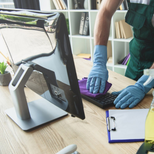 person cleaning a table office